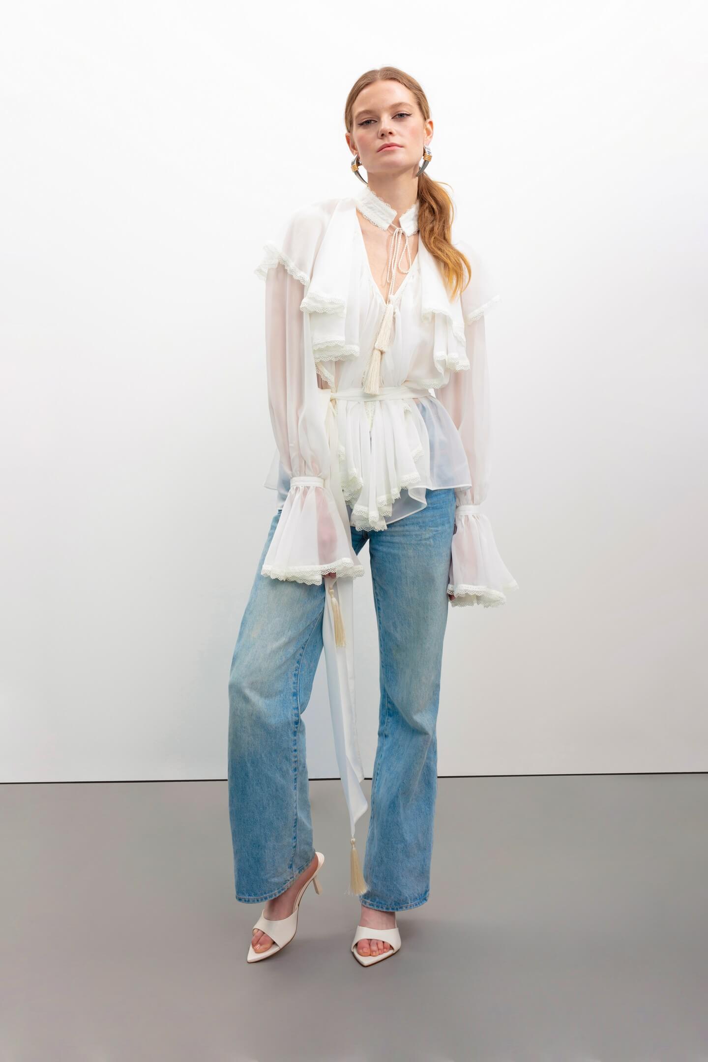 Model in Ocean Of Tenderness white blouse front view